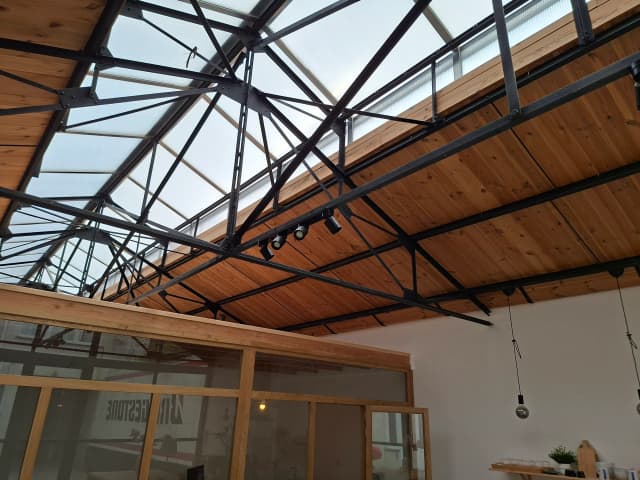 Ceiling with steel beams and skylights