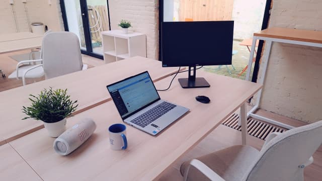 Workstation with monitor and laptop